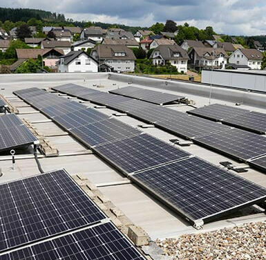 Image of several solar panels on the roof of a building